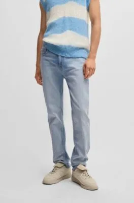 Jeans slim fit de denim azul lavado a la piedra