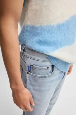Jeans slim fit de denim azul lavado a la piedra