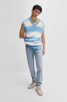 Jeans slim fit de denim azul lavado a la piedra