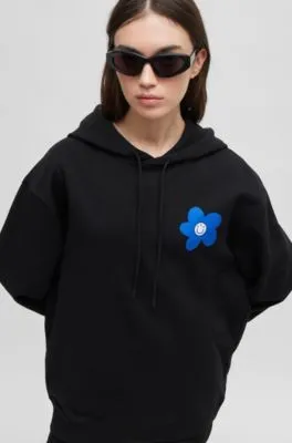 Sudadera con capucha para todos los géneros en felpa de algodón con estampado de flores y logos