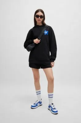 Sudadera con capucha para todos los géneros en felpa de algodón con estampado de flores y logos